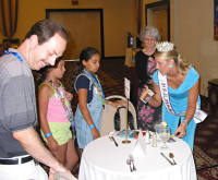 Mrs. Maryland International spends time talking with attendees at the event!
